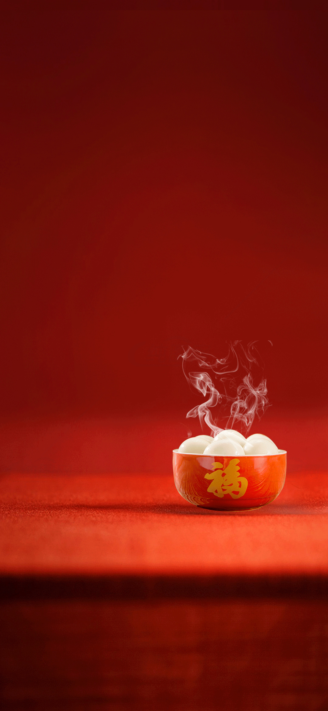 传统中式红色背景下的热气腾腾汤圆素材