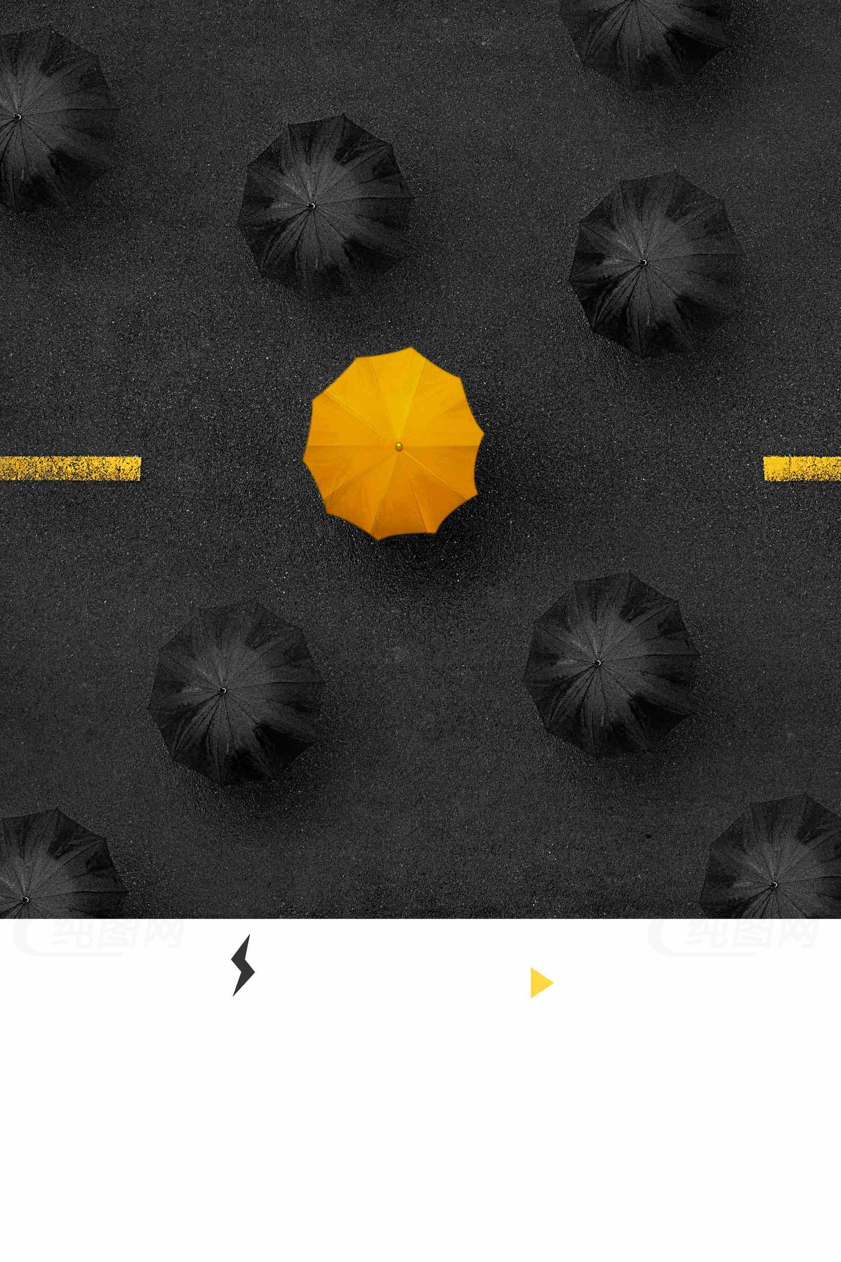 黄色雨伞与黑色背景的创意对比图片素材